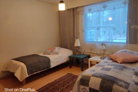 Two beds and two night stands in the bedroom